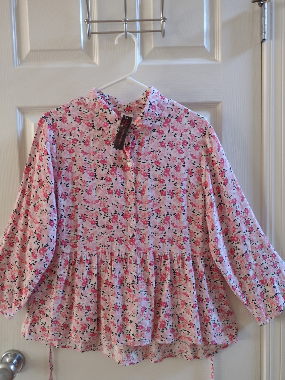 Woman's Pink Floral Peplum Top